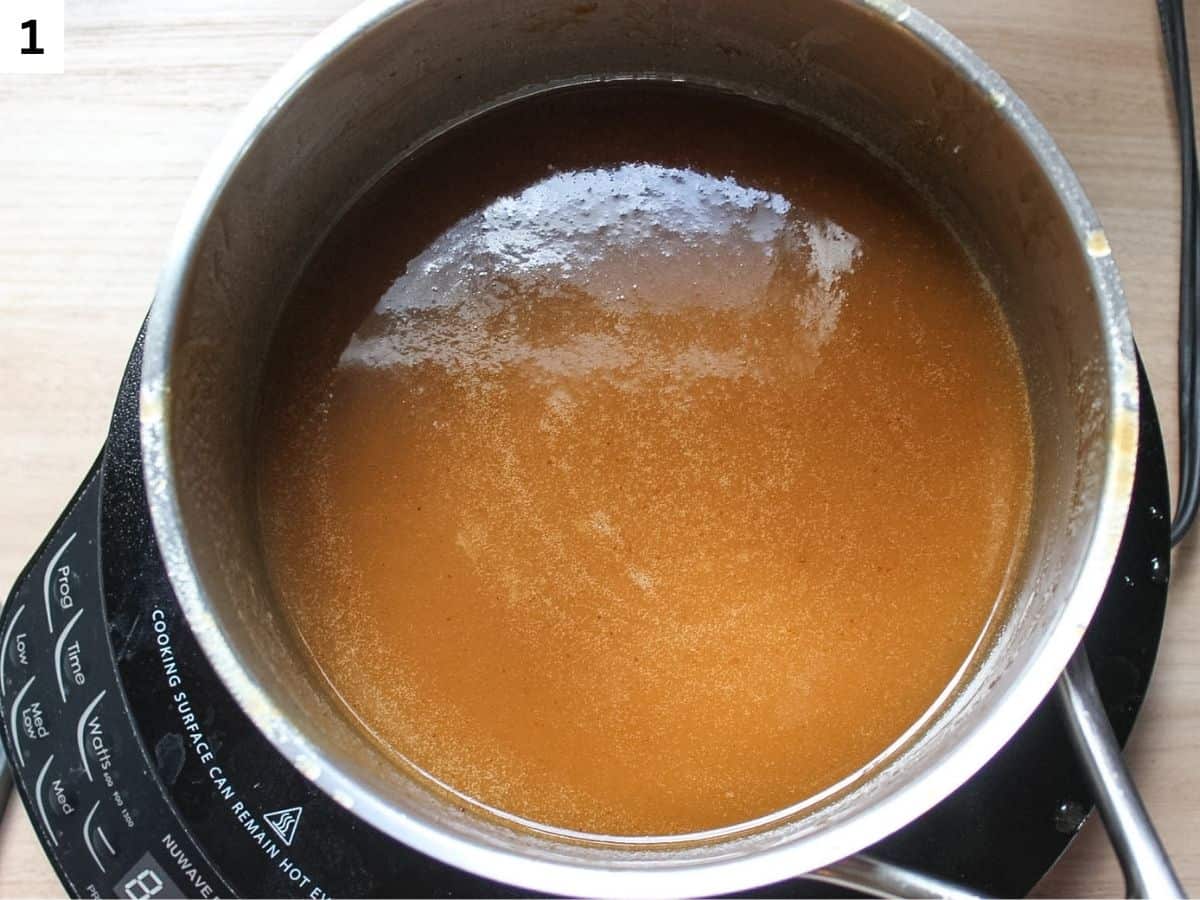 Reducing apple cider in a pot. 