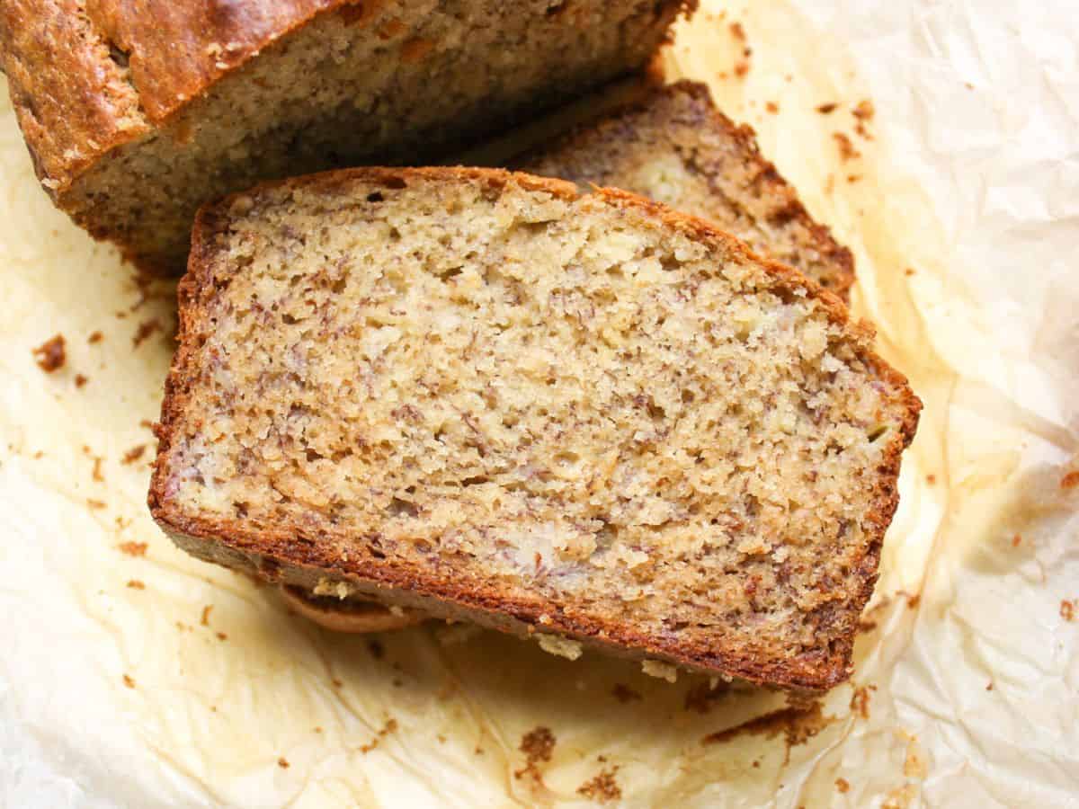 Honey banana bread slice on a parchment paper.