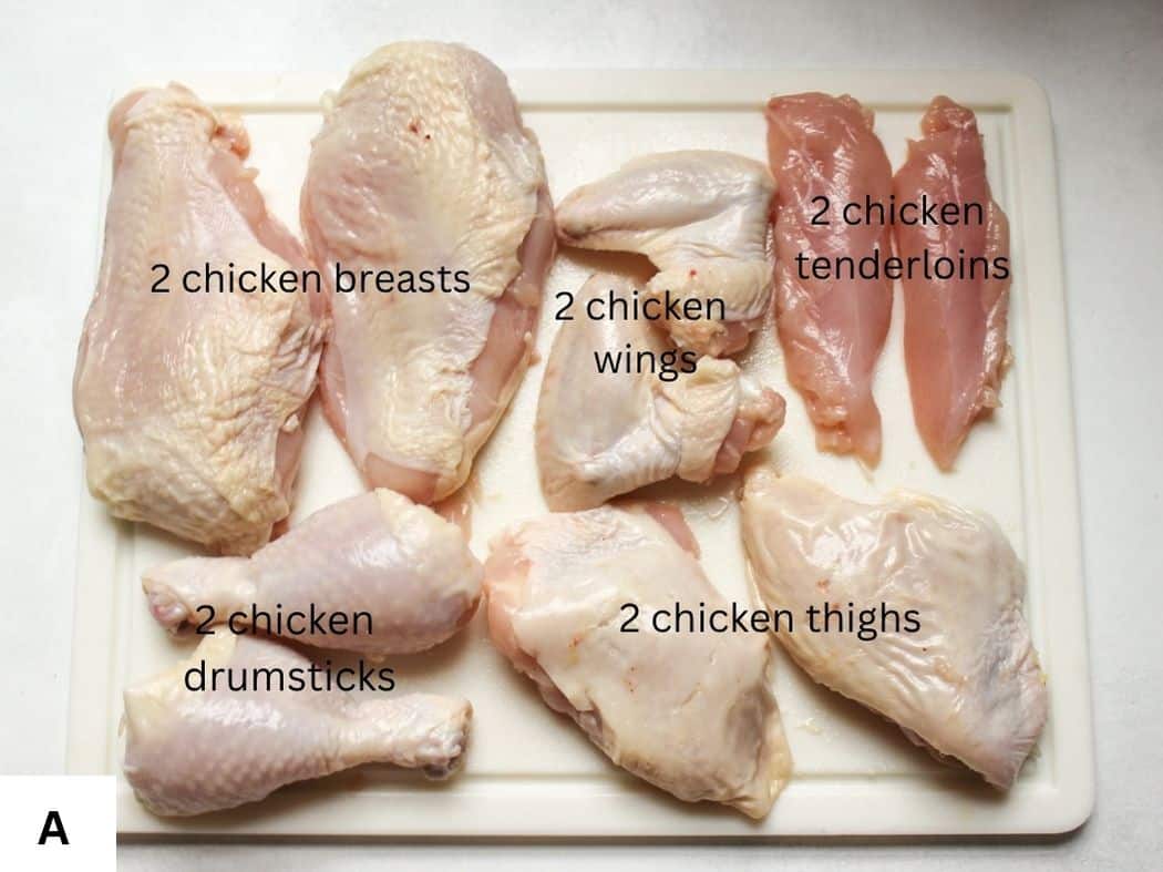 Freshly cut 10-piece whole chicken arranged on a cutting board, including breasts, tenderloins, wings, drumsticks, and thighs.